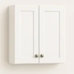 Wall-mounted double-door cabinet in white finish, featuring minimalist design and brushed metal knobs, representing high-quality RTI cabinetry solutions for home renovation projects.